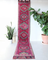 Vintage Turkish runner rug in a living room setting, pile rug, Turkish rug, vintage rug, portland, rug shop, bright colors, wild shaman, soft rug, bold color, Portland, Oregon, rug store, rug shop, local shop