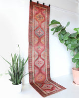 Vintage Turkish runner rug in a living room setting, pile rug, Turkish rug, vintage rug, portland, rug shop, bright colors, wild shaman, soft rug, bold color, Portland, Oregon, rug store, rug shop, local shop