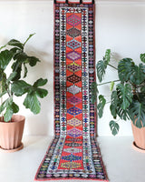 Vintage Turkish runner rug in a living room setting, pile rug, Turkish rug, vintage rug, portland, rug shop, bright colors, wild shaman, soft rug, bold color, Portland, Oregon, rug store, rug shop, local shop
