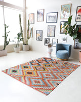 Vintage kilim rug in room decor setting, old rug, antique rug, pastel colors, faded colors, Turkish rug, vintage rug, soft rug, Portland, Oregon, rug store, rug shop, local shop, bold colors, bright colors, faded colors