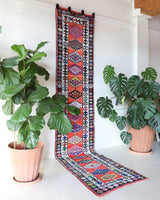 Vintage Turkish runner rug in a living room setting, pile rug, Turkish rug, vintage rug, portland, rug shop, bright colors, wild shaman, soft rug, bold color, Portland, Oregon, rug store, rug shop, local shop