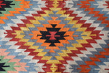 Vintage kilim rug in room decor setting, old rug, antique rug, pastel colors, faded colors, Turkish rug, vintage rug, soft rug, Portland, Oregon, rug store, rug shop, local shop, bold colors, bright colors, faded colors