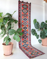 Vintage Turkish runner rug in a living room setting, pile rug, Turkish rug, vintage rug, portland, rug shop, bright colors, wild shaman, soft rug, bold color, Portland, Oregon, rug store, rug shop, local shop