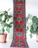 Vintage Turkish runner rug in a living room setting, pile rug, Turkish rug, vintage rug, portland, rug shop, bright colors, wild shaman, soft rug, bold color, Portland, Oregon, rug store, rug shop, local shop