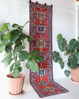 Vintage Turkish runner rug in a living room setting, pile rug, Turkish rug, vintage rug, portland, rug shop, bright colors, wild shaman, soft rug, bold color, Portland, Oregon, rug store, rug shop, local shop