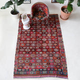 Vintage kilim rug in room decor setting, old rug, antique rug, pastel colors, faded colors, Turkish rug, vintage rug, soft rug, Portland, Oregon, rug store, rug shop, local shop, bold colors, bright colors, faded colors