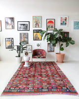 Vintage kilim rug in room decor setting, old rug, antique rug, pastel colors, faded colors, Turkish rug, vintage rug, soft rug, Portland, Oregon, rug store, rug shop, local shop, bold colors, bright colors, faded colors