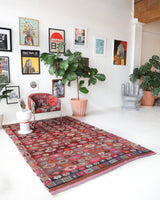 Vintage kilim rug in room decor setting, old rug, antique rug, pastel colors, faded colors, Turkish rug, vintage rug, soft rug, Portland, Oregon, rug store, rug shop, local shop, bold colors, bright colors, faded colors
