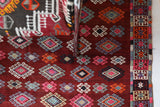 Vintage kilim rug in room decor setting, old rug, antique rug, pastel colors, faded colors, Turkish rug, vintage rug, soft rug, Portland, Oregon, rug store, rug shop, local shop, bold colors, bright colors, faded colors