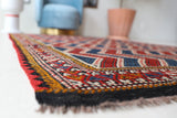 Vintage kilim rug in living room setting, bright colors, wild shaman, soft rug, bold color, Portland, Oregon, rug store, rug shop, local shop, vintage rug, modern kilim, warm colors