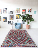 Vintage kilim rug in room decor setting, old rug, antique rug, pastel colors, faded colors, Turkish rug, vintage rug, soft rug, Portland, Oregon, rug store, rug shop, local shop, bold colors, bright colors, faded colors