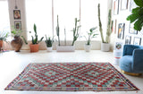 Vintage kilim rug in room decor setting, old rug, antique rug, pastel colors, faded colors, Turkish rug, vintage rug, soft rug, Portland, Oregon, rug store, rug shop, local shop, bold colors, bright colors, faded colors