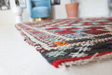 Vintage kilim rug in room decor setting, old rug, antique rug, pastel colors, faded colors, Turkish rug, vintage rug, soft rug, Portland, Oregon, rug store, rug shop, local shop, bold colors, bright colors, faded colors
