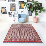 Vintage kilim rug in room decor setting, old rug, antique rug, pastel colors, faded colors, Turkish rug, vintage rug, soft rug, Portland, Oregon, rug store, rug shop, local shop, bold colors, bright colors, faded colors