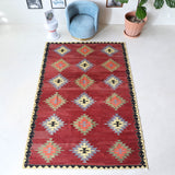 Vintage kilim rug in room decor setting, old rug, antique rug, pastel colors, faded colors, Turkish rug, vintage rug, soft rug, Portland, Oregon, rug store, rug shop, local shop, bold colors, bright colors, faded colors