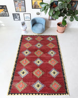 Vintage kilim rug in room decor setting, old rug, antique rug, pastel colors, faded colors, Turkish rug, vintage rug, soft rug, Portland, Oregon, rug store, rug shop, local shop, bold colors, bright colors, faded colors