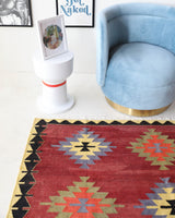 Vintage kilim rug in room decor setting, old rug, antique rug, pastel colors, faded colors, Turkish rug, vintage rug, soft rug, Portland, Oregon, rug store, rug shop, local shop, bold colors, bright colors, faded colors