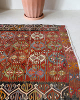 Vintage kilim rug in living room setting, bright colors, wild shaman, soft rug, bold color, Portland, Oregon, rug store, rug shop, local shop, vintage rug, modern kilim, warm colors