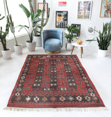 Vintage kilim rug in living room setting, old rug, antique rug, pastel colors, faded colors, Turkish rug, vintage rug, soft rug, Portland, Oregon, rug store, rug shop, local shop, earthy tones, earthy colors, warm colors