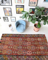 Vintage kilim rug in living room setting, bright colors, wild shaman, soft rug, bold color, Portland, Oregon, rug store, rug shop, local shop, vintage rug, modern kilim, warm colors