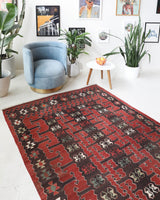 Vintage kilim rug in living room setting, old rug, antique rug, pastel colors, faded colors, Turkish rug, vintage rug, soft rug, Portland, Oregon, rug store, rug shop, local shop, earthy tones, earthy colors, warm colors