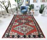 Vintage kilim rug in room decor setting, old rug, antique rug, pastel colors, faded colors, Turkish rug, vintage rug, soft rug, Portland, Oregon, rug store, rug shop, local shop, bold colors, bright colors, faded colors