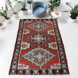 Vintage kilim rug in room decor setting, old rug, antique rug, pastel colors, faded colors, Turkish rug, vintage rug, soft rug, Portland, Oregon, rug store, rug shop, local shop, bold colors, bright colors, faded colors