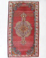 Vintage kilim rug in living room setting, old rug, antique rug, pastel colors, faded colors, Turkish rug, vintage rug, soft rug, Portland, Oregon, rug store, rug shop, local shop, earthy tones, earthy colors, warm colors