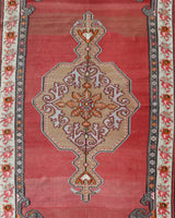 Vintage kilim rug in living room setting, old rug, antique rug, pastel colors, faded colors, Turkish rug, vintage rug, soft rug, Portland, Oregon, rug store, rug shop, local shop, earthy tones, earthy colors, warm colors