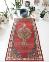 Vintage kilim rug in living room setting, old rug, antique rug, pastel colors, faded colors, Turkish rug, vintage rug, soft rug, Portland, Oregon, rug store, rug shop, local shop, earthy tones, earthy colors, warm colors