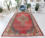 Vintage kilim rug in living room setting, old rug, antique rug, pastel colors, faded colors, Turkish rug, vintage rug, soft rug, Portland, Oregon, rug store, rug shop, local shop, earthy tones, earthy colors, warm colors