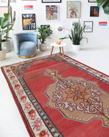 Vintage kilim rug in living room setting, old rug, antique rug, pastel colors, faded colors, Turkish rug, vintage rug, soft rug, Portland, Oregon, rug store, rug shop, local shop, earthy tones, earthy colors, warm colors