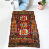 Vintage Turkish rug in a living room setting, pile rug, Turkish rug, vintage rug, portland, rug shop, bright colors, wild shaman, soft rug, bold color, Portland, Oregon, rug store, rug shop, local shop, shag rug, shaggy, plush,tulu rugs