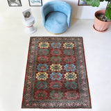 Vintage Turkish rug in a living room setting, pile rug, Turkish rug, vintage rug, portland, rug shop, bright colors, wild shaman, soft rug, bold color, Portland, Oregon, rug store, rug shop, local shop, antique rug