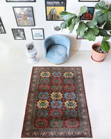 Vintage Turkish rug in a living room setting, pile rug, Turkish rug, vintage rug, portland, rug shop, bright colors, wild shaman, soft rug, bold color, Portland, Oregon, rug store, rug shop, local shop, antique rug