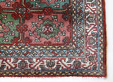 Vintage Turkish rug in a living room setting, pile rug, Turkish rug, vintage rug, portland, rug shop, bright colors, wild shaman, soft rug, bold color, Portland, Oregon, rug store, rug shop, local shop, antique rug