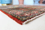 Vintage Turkish rug in a living room setting, pile rug, Turkish rug, vintage rug, portland, rug shop, bright colors, wild shaman, soft rug, bold color, Portland, Oregon, rug store, rug shop, local shop, antique rug