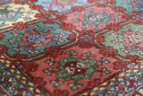 Vintage Turkish rug in a living room setting, pile rug, Turkish rug, vintage rug, portland, rug shop, bright colors, wild shaman, soft rug, bold color, Portland, Oregon, rug store, rug shop, local shop, antique rug