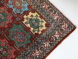 Vintage Turkish rug in a living room setting, pile rug, Turkish rug, vintage rug, portland, rug shop, bright colors, wild shaman, soft rug, bold color, Portland, Oregon, rug store, rug shop, local shop, antique rug