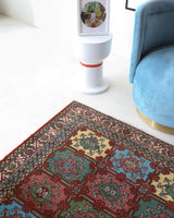 Vintage Turkish rug in a living room setting, pile rug, Turkish rug, vintage rug, portland, rug shop, bright colors, wild shaman, soft rug, bold color, Portland, Oregon, rug store, rug shop, local shop, antique rug