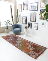 Vintage Turkish runner rug in a living room setting, pile rug, Turkish rug, vintage rug, portland, rug shop, bright colors, wild shaman, soft rug, bold color, Portland, Oregon, rug store, rug shop, local shop, antique rug