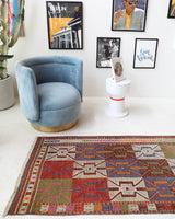 Vintage Turkish runner rug in a living room setting, pile rug, Turkish rug, vintage rug, portland, rug shop, bright colors, wild shaman, soft rug, bold color, Portland, Oregon, rug store, rug shop, local shop, antique rug