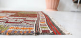 Vintage Turkish runner rug in a living room setting, pile rug, Turkish rug, vintage rug, portland, rug shop, bright colors, wild shaman, soft rug, bold color, Portland, Oregon, rug store, rug shop, local shop, antique rug
