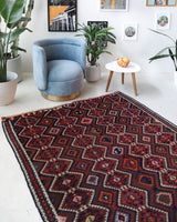 Vintage kilim rug in living room setting, bright colors, wild shaman, soft rug, bold color, Portland, Oregon, rug store, rug shop, local shop, vintage rug, modern kilim, warm colors