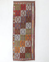 Vintage Turkish runner rug in a living room setting, pile rug, Turkish rug, vintage rug, portland, rug shop, bright colors, wild shaman, soft rug, bold color, Portland, Oregon, rug store, rug shop, local shop, antique rug