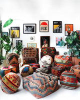 Floor pouf in a living room setting, pillow, turkish pillow, kilim pillow, home decor, decorative pillow, sham, rug pillow, decor, home decor, pouf, floor cushion, cushion, Portland, rugshop, Oregon, Wild Shaman, ottoman