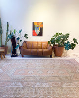 Vintage Turkish rug in living room setting, old rug, antique rug, pastel colors, faded colors, Turkish rug, vintage rug, soft rug, Portland, Oregon, rug store, rug shop, local shop