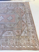 Vintage Turkish rug in living room setting, old rug, antique rug, pastel colors, faded colors, Turkish rug, vintage rug, soft rug, Portland, Oregon, rug store, rug shop, local shop