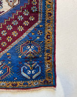 Vintage Turkish rug in a living room setting, pile rug, Turkish rug, vintage rug, portland, rug shop, bright colors, wild shaman, soft rug, bold color, Portland, Oregon, rug store, rug shop, local shop