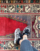 Vintage Turkish rug in a living room setting, pile rug, Turkish rug, vintage rug, portland, rug shop, bright colors, wild shaman, soft rug, bold color, Portland, Oregon, rug store, rug shop, local shop, antique rug